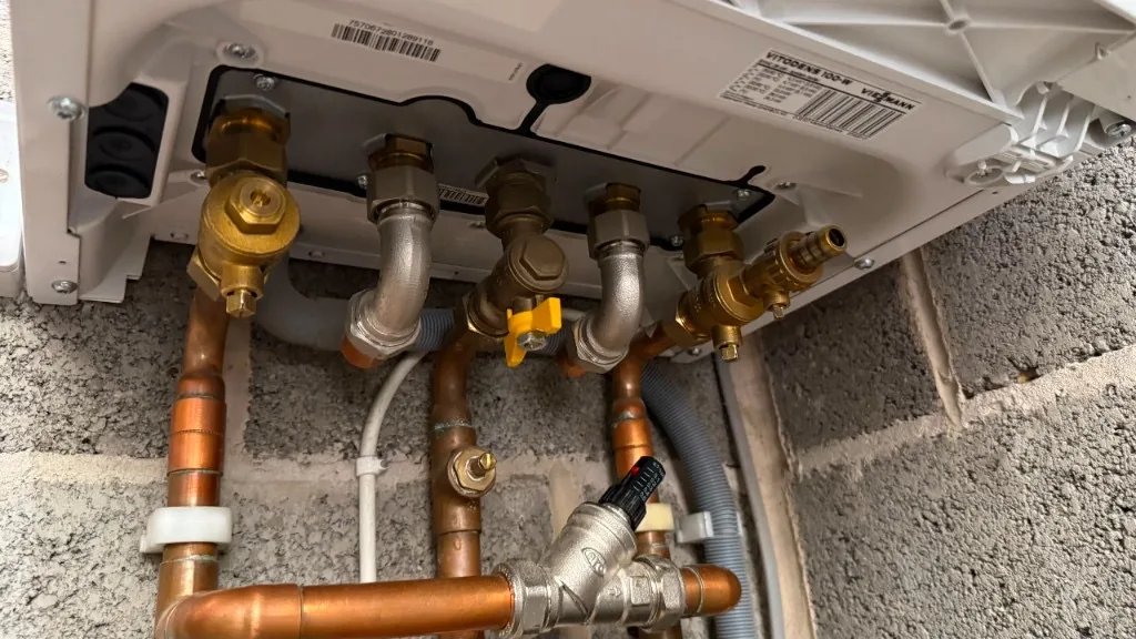 Underside pipework and yellow gas valve on a Viessmann Vitodens 100-W
